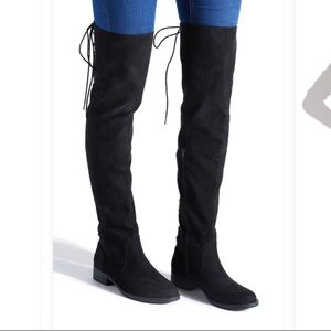 Over the knee flat boots